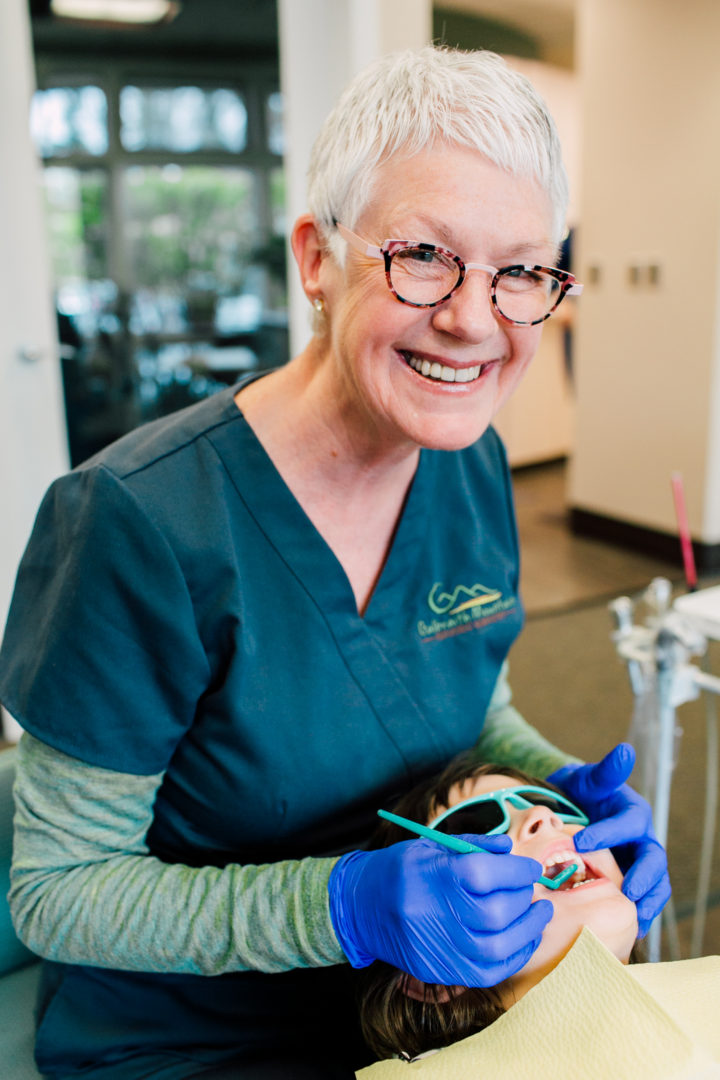 pediatric dental assistant wearing anne et valentin glasses photography by Katheryn Moran Photography