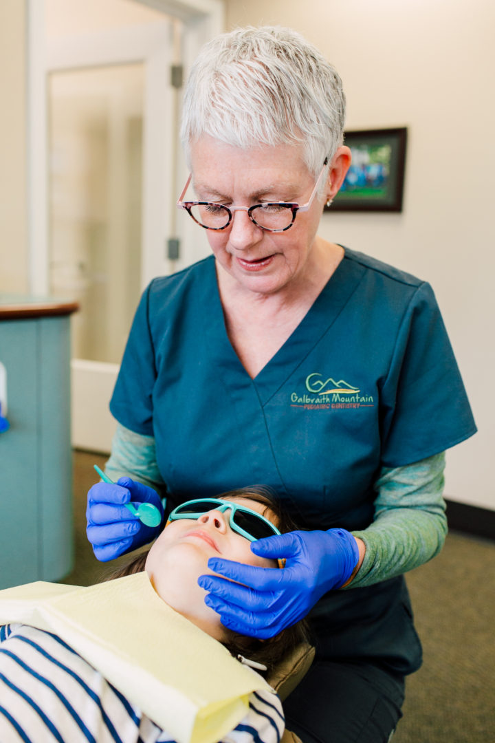pediatric dental assistant wearing anne et valentin glasses photography by Katheryn Moran Photography